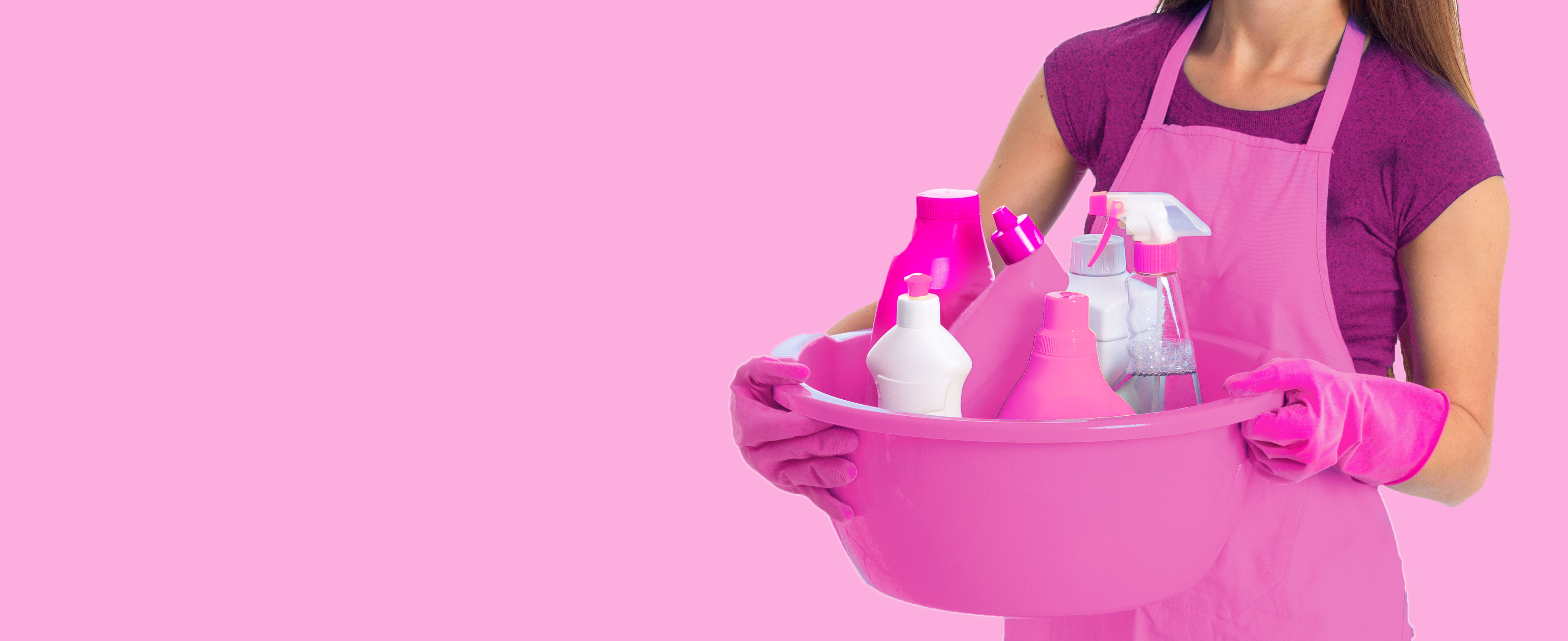 Cleaner holding bowl of pink cleaning products